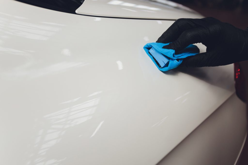 Ceramic Coating booster being applied to car paint in Burlington
